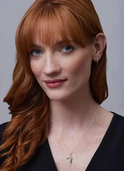 Red haired model wearing Sterling Silver Connemara Marble Harp Pendant